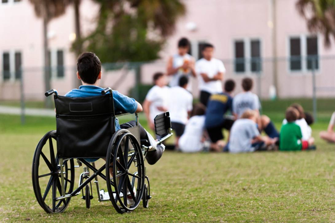 A child in a wheelchair in a field

AI-generated content may be incorrect.